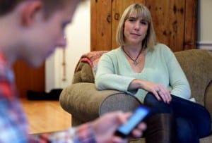 6 Words You Should Say Today - Providence Holistic Counseling Services - mom watching teen boy on smartphone