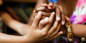 Look Up and Get Connected - Providence Holistic Counseling Services - holding hands b&W