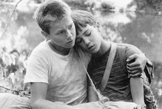 - teenage boy with arm around friend