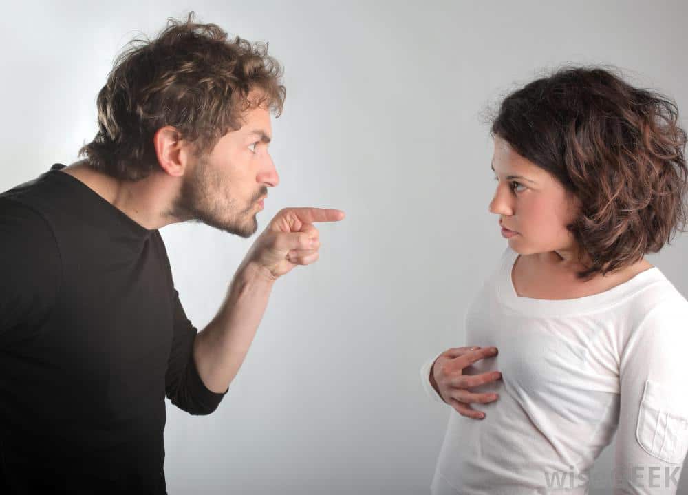 Building Bridges or Building Walls - Providence Holistic Counseling Services - man-in-black-shirt-pointing-at-woman-in-white
