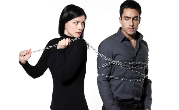 Obsessions and Compulsions: Zen Buddhism Help or Hurt? - Providence Holistic Counseling Services - woman binding his man with a chain on white background