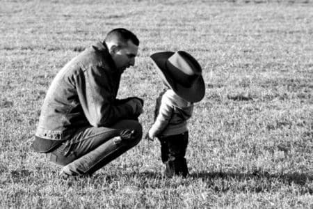 Listen To Their Story - Ex-CIA Undercover Officer - Man listening to boy with hat